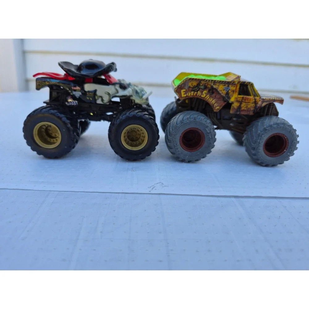 Monster Jam Pirates Curse and Zombie vs Hunter Earth Shaker Die-Cast Truck Lot